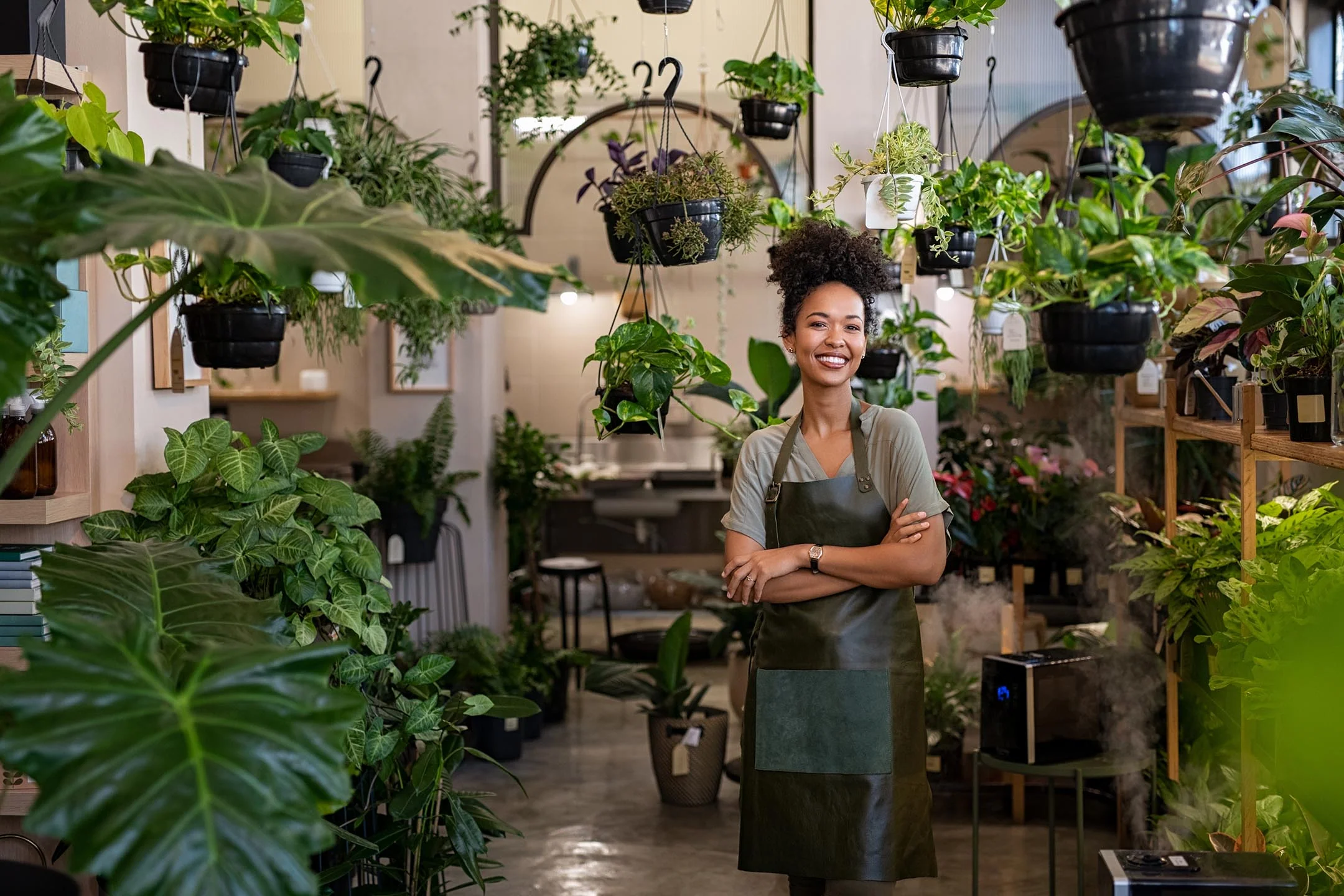 woman standing inside modern plant shop